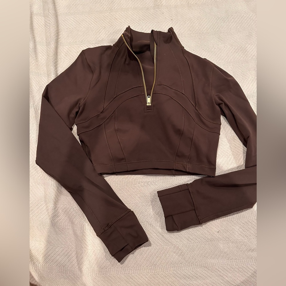Define cropped half zip *luon*, never worn, but I did rip off the tag.